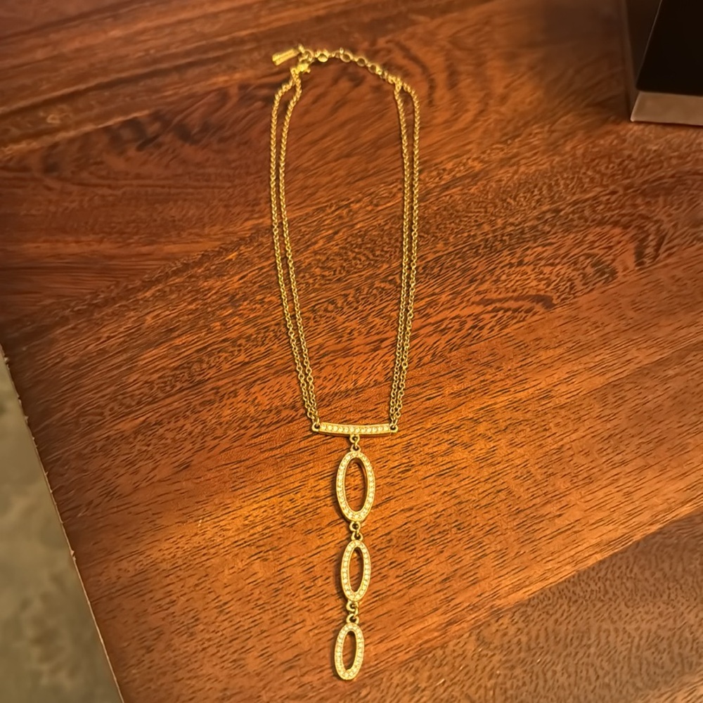 Napier Necklace. Gold tone double rolo chain. Pendant has rhinestone crystals